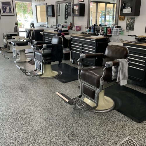 A barber shop with chairs